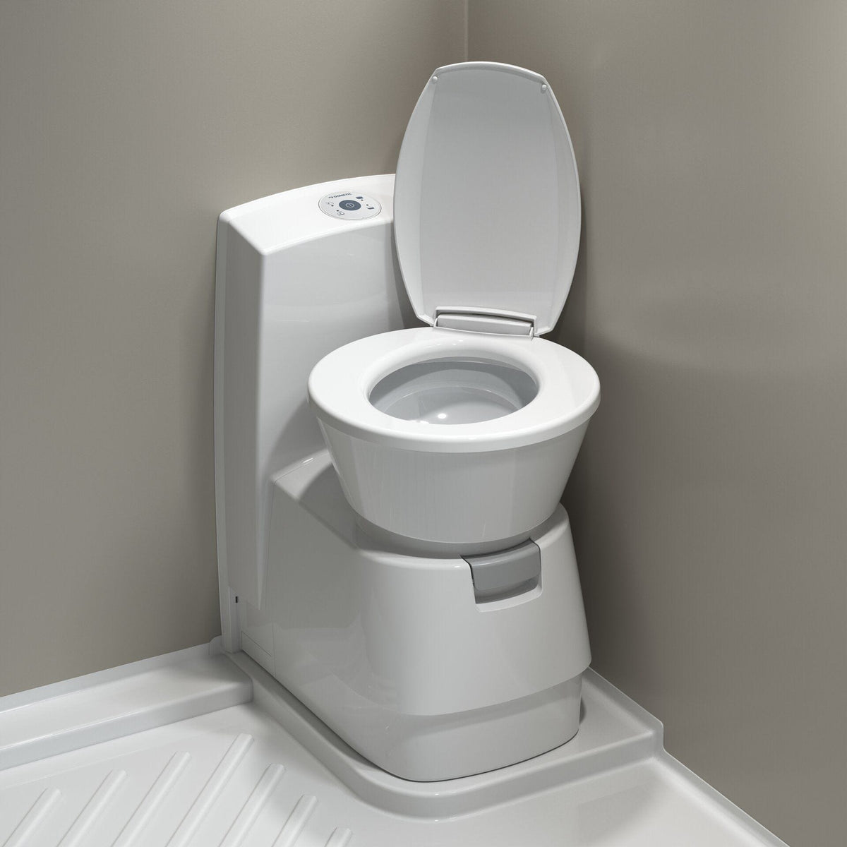 Dometic CTS 4110 cassette toilet installed in a caravan bathroom with the seat lid open