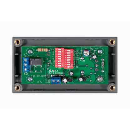Victron Battery Alarm GX - rear view, exposed PCB with two DIP switch banks, relay and screw terminals