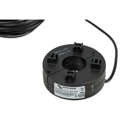 Victron Current Transformer 400A:50mA for MultiPlus-II, part CTR140050100, close-up of the black round split-core transformer showing the Victron Energy label and hinged clamp opening