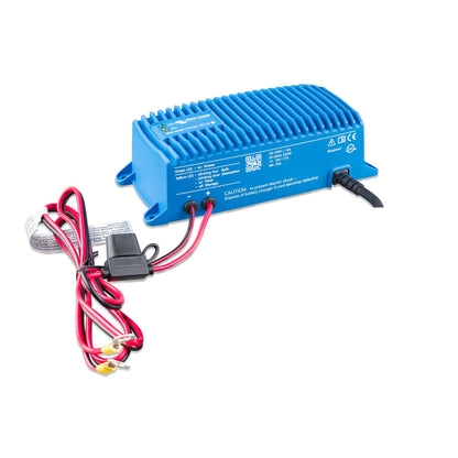 Victron Blue Smart IP67 12/17 waterproof battery charger, three-quarter view showing the 110-120V NEMA 5-15 spec panel, DC output cables and inline fuse holder